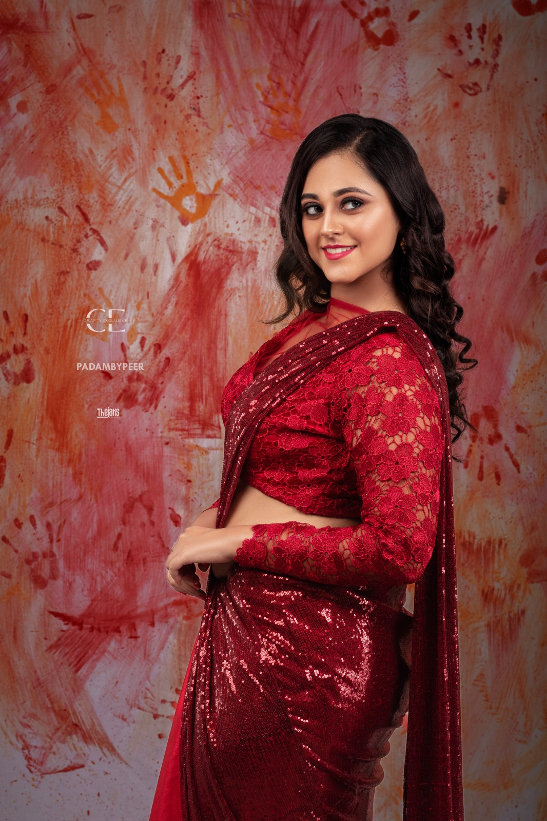 South Indian bride in red silk saree with gold temple jewellery